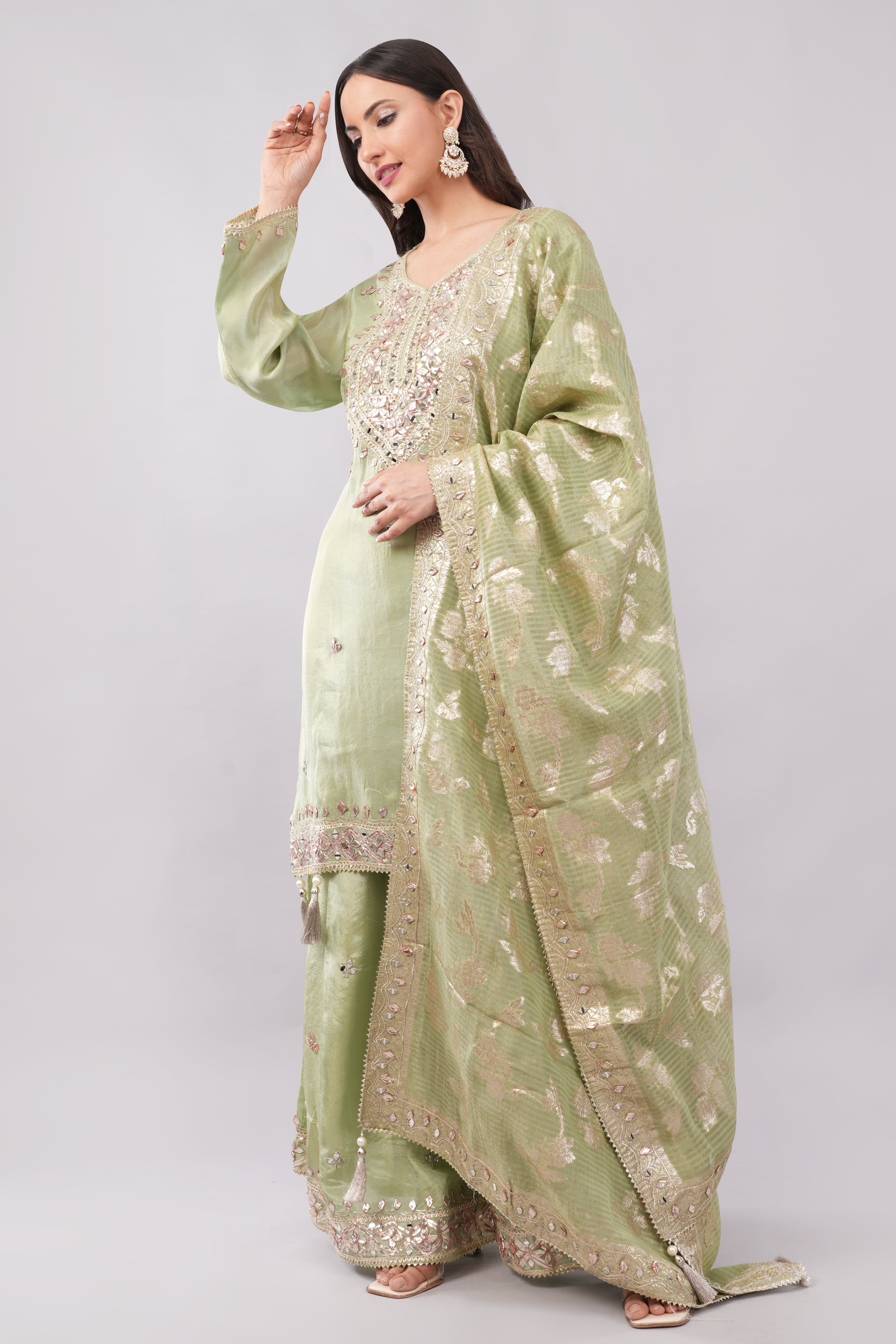 Olive green silk suit with heavy work dupatta