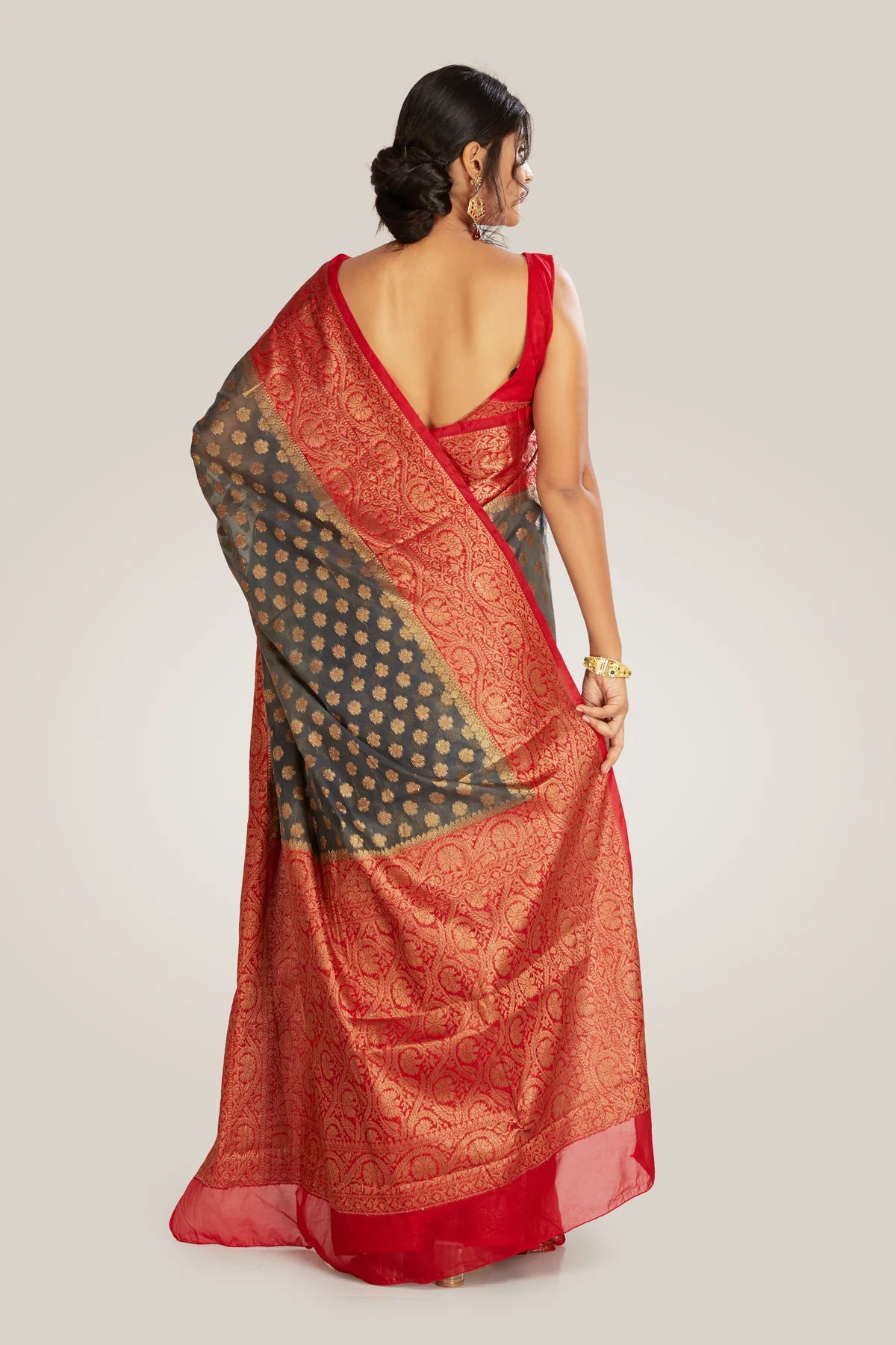 Saree in ash gray and red with resham and zari on tissue
