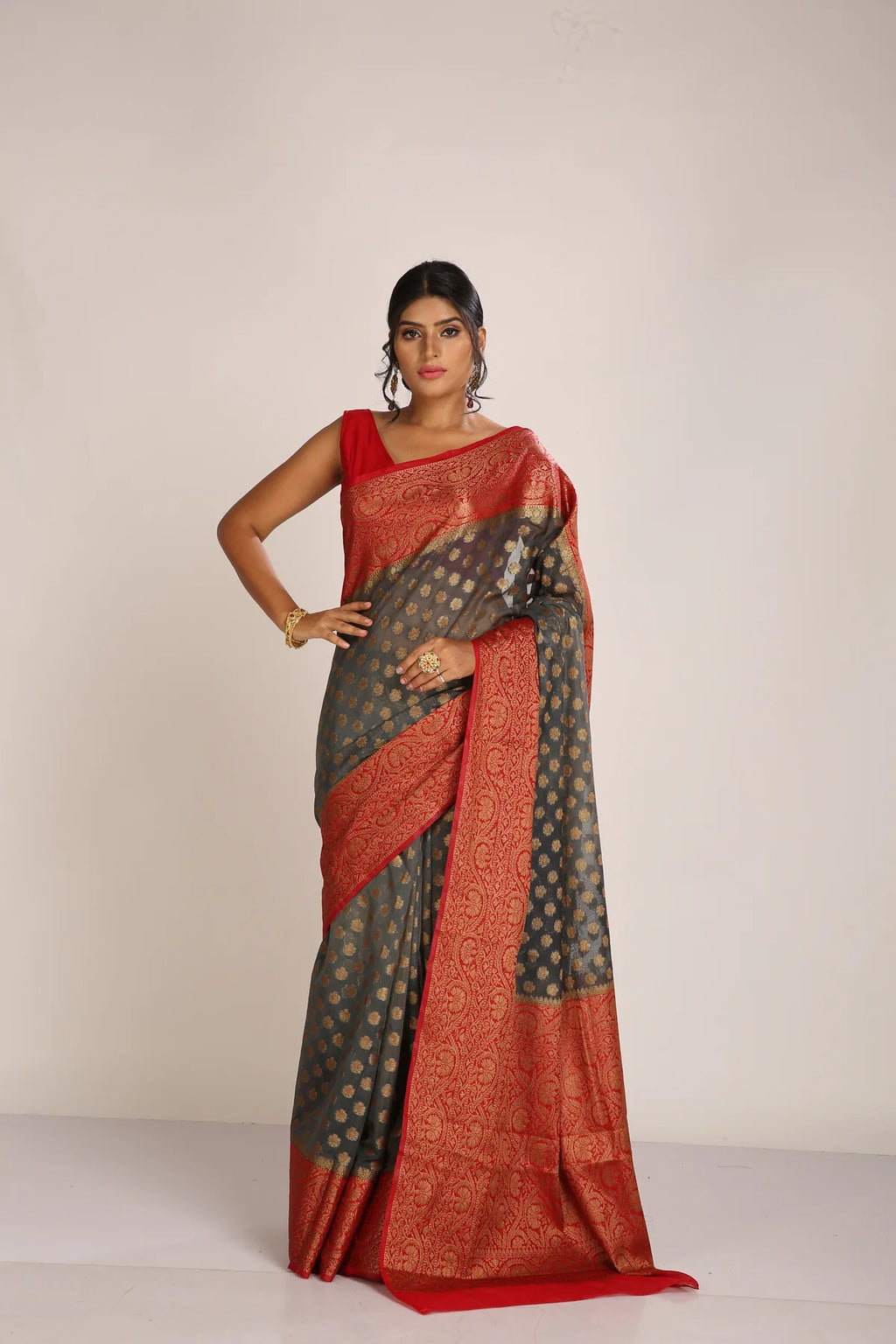 Saree in ash gray and red with resham and zari on tissue