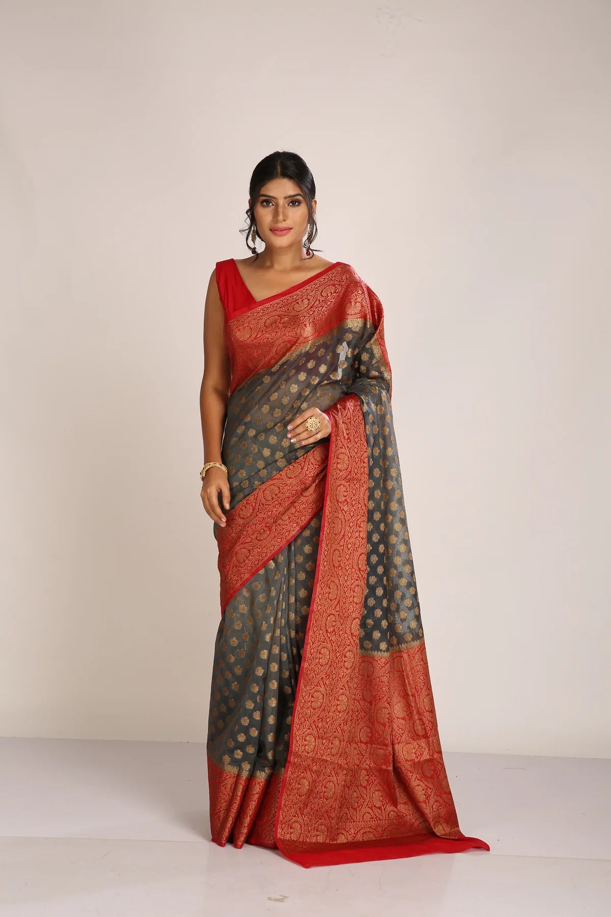 Saree in ash gray and red with resham and zari on tissue